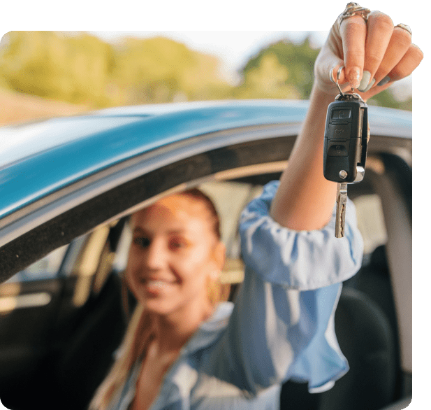 Happy lady holding a car key